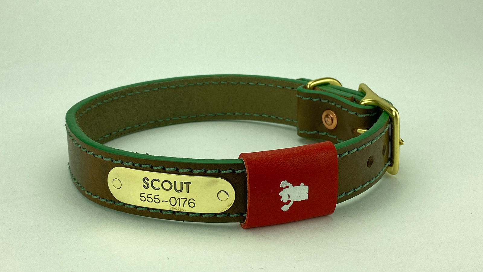 #4. Olive leather, pine stitch, grass green edge, red badge. Shown with natural brass hardware.