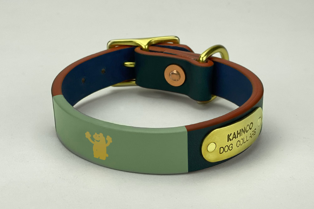 #18. Blue leather, grey band, gold bear, coral edge and brass hardware. Shown in 3/4” width.