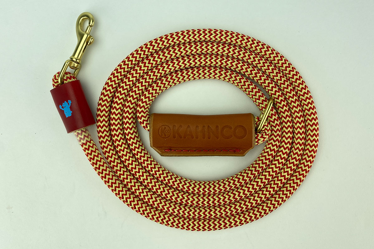 #6. Red and natural rope with tan leather handle and natural brass hardware.
