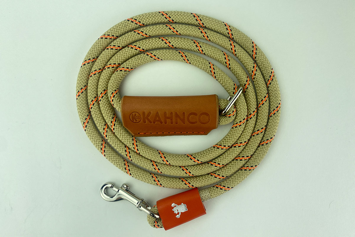 #8. Natural and neon orange striped rope with tan leather handle and satin Nickel hardware.